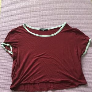 A cropped maroon shirt
